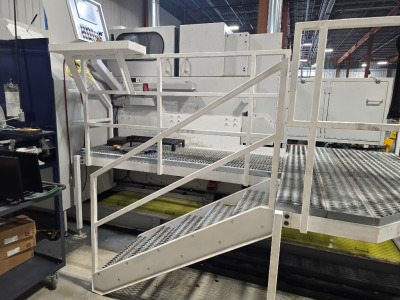 Custom designed steel platform for operation and maintenance of a bolt heading machine at a local hardware manufacturer; designed, fabricated and installed by M&M Certified Welding Company in Macedonia, Ohio