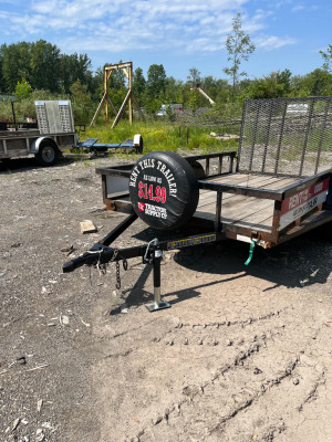 small black trailer repaired by M&M Certified Welding