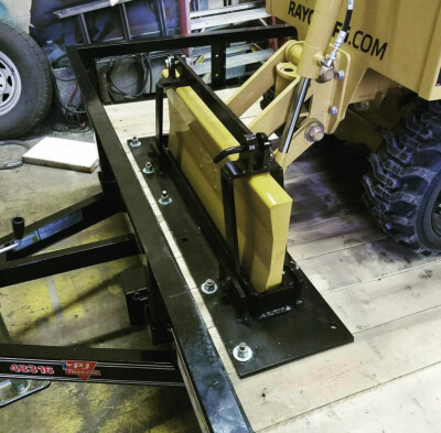 Custom holder bracket for a stump grinder