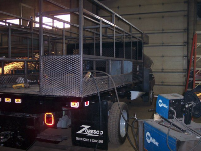 Ladder rack and tool boxes custom designed for a truck bed