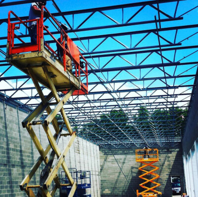 Erecting a new roof on the addition to the Liberty Ford dealership in Brunswick, Ohio