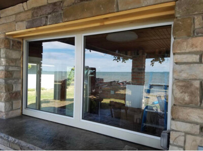 Custom aluminum framed windows that swing open when the bar is open!